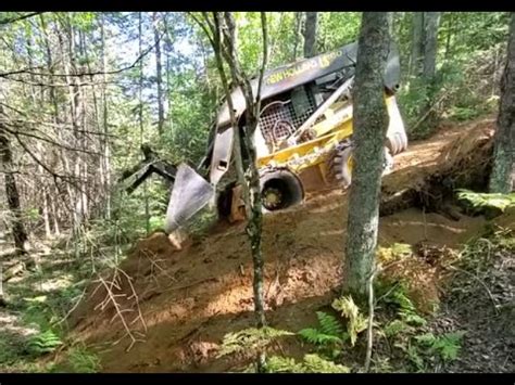 how steep of a hill can a skid steer climb|skid steer t300 handle steep.